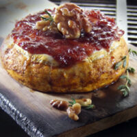 Cedar Planked Baked Brie with Sun Dried Cherry Sauce