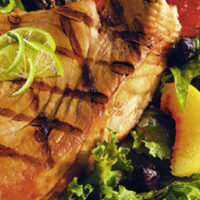 Grilled Tuna Served on Wild Greens Laced with Sun Dried Cherry Vinaigrette